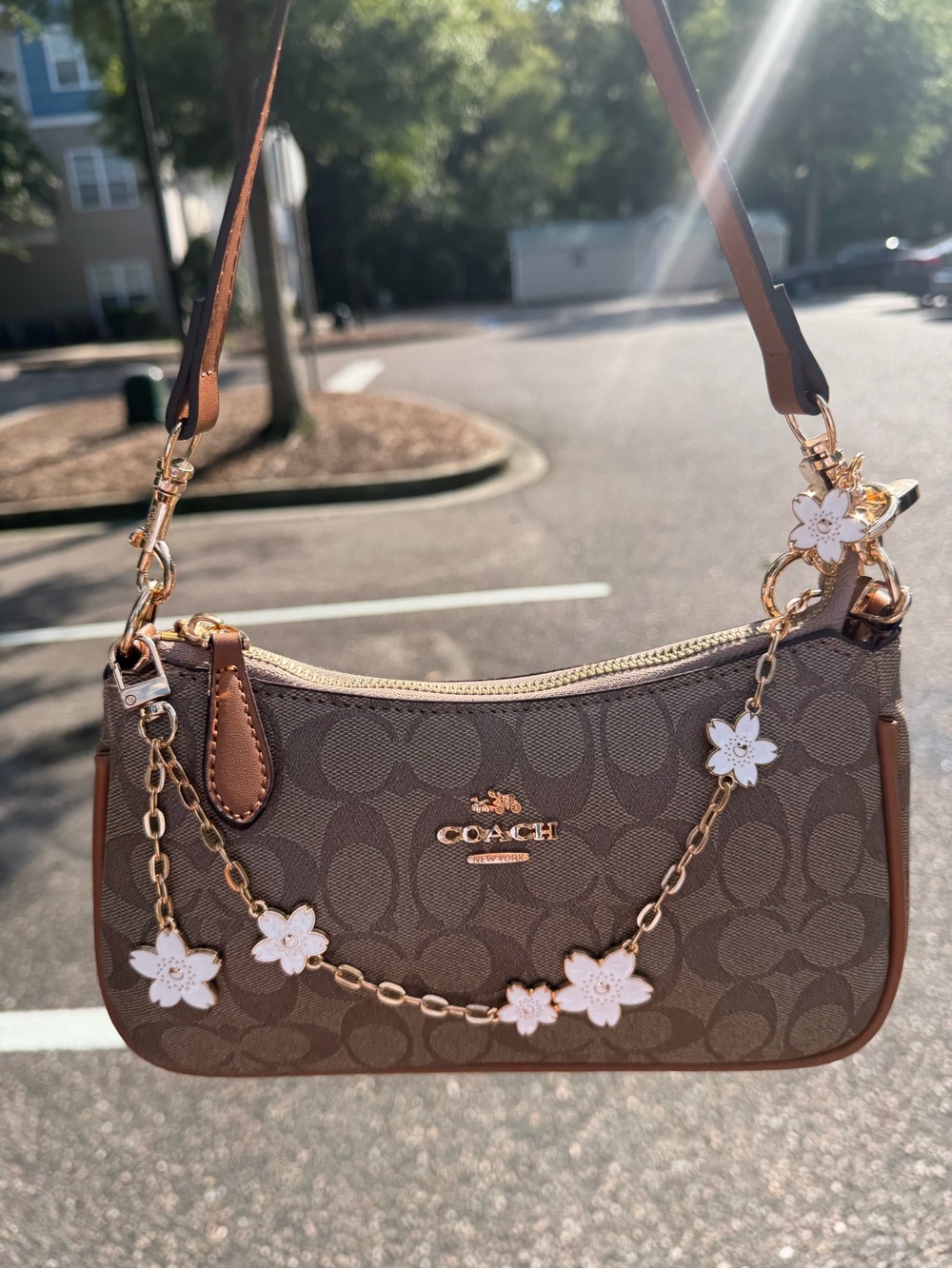 Coach Brown Signature Canvas Shoulder Bag with White Floral Charm Chain